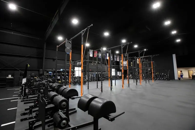 Wide view of Iron Forge training floor and rig
