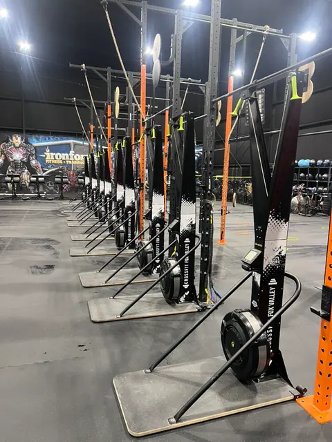 Line of ski erg machines inside Iron Forge